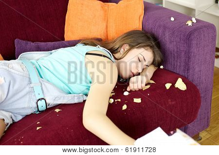Sleepy Teenager After Having Done Mess With Chips And Pop Corn