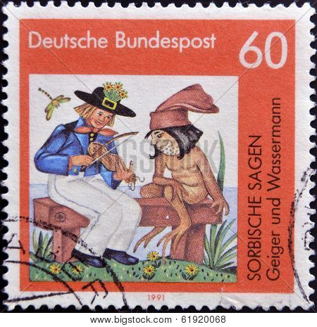 GERMANY - CIRCA 1991: A stamp printed in Germany shows Sorbian legends: Geiger and the waterman
