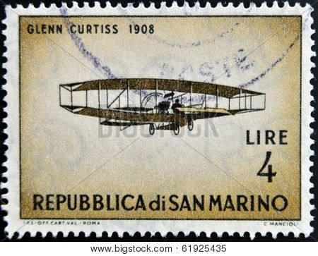 SAN MARINO - CIRCA 1962: A stamp printed in San Marino shows airplane by Glenn Curtiss 1908