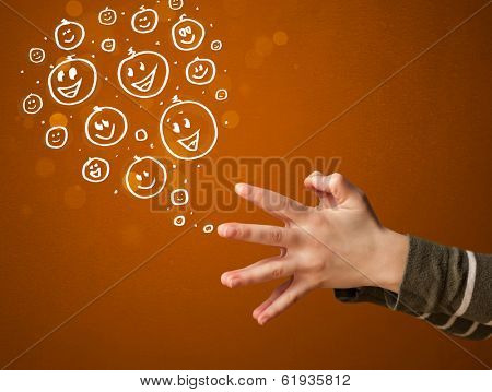 Group of happy hand drawed smiley faces coming out of gun shaped hands