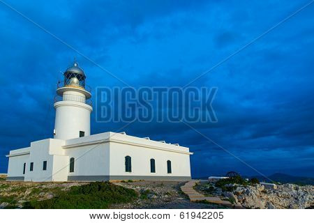 Menorca sunset in Faro Far de Caballeria Lighthouse at Balearic Islands es Mercadal