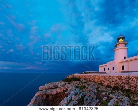 Menorca sunset in Faro Far de Caballeria Lighthouse at Balearic Islands es Mercadal