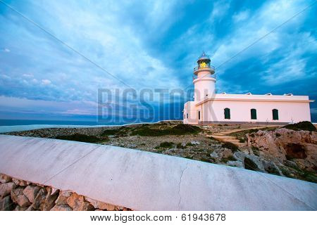 Menorca sunset in Faro Far de Caballeria Lighthouse at Balearic Islands es Mercadal
