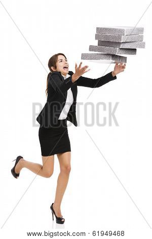 Woman in the office stumbling with a pile of folders in the hands, isolated on white