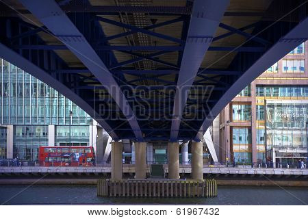 LONDON, UK - CANARY WHARF,  MARCH 22, 2014: view on DLR support bridge and Bank road