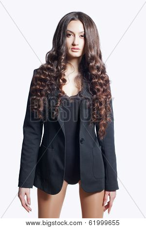 beautiful sexy woman with curly hair in kombidress and black jacket