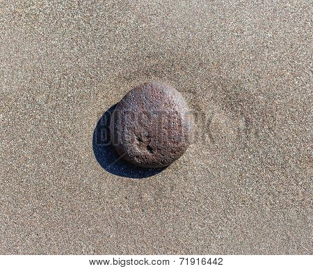 Stone On Ocean Sand