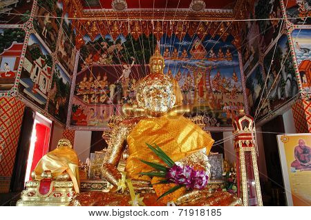 Monk Statue Covered with Gold Leafs