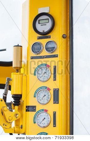 Meters or gauge in crane cabin for measure