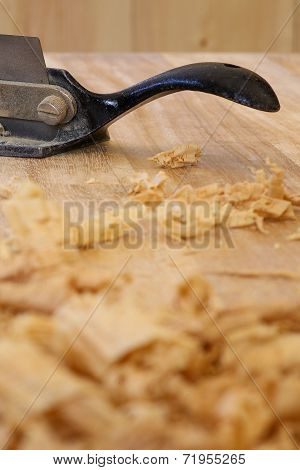 Chip Shavings with Spokeshave of Sapele Hardwood Board