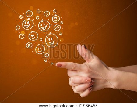 Group of happy hand drawed smiley faces coming out of gun shaped hands