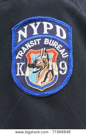 Close up of shoulder  patch of NYPD Transit Bureau K-9 Unit