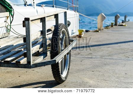 Big marina trolley for crew baggage on the pier