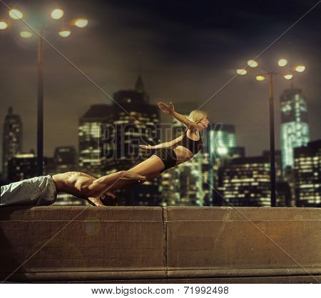 Fit couple in the city at night