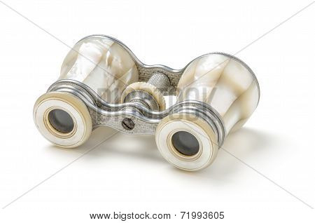 Antique opera glass with nacre on a white background