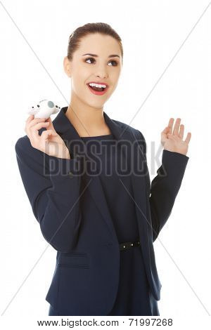 Young businesswoman with plane toy in hand