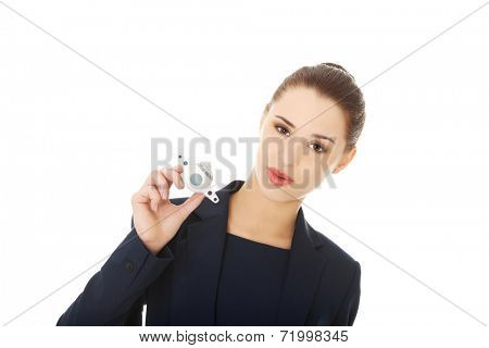 Young businesswoman with plane toy in hand