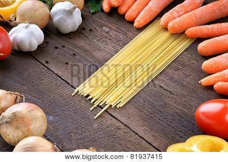 Pasta with fresh vegetables on the table
