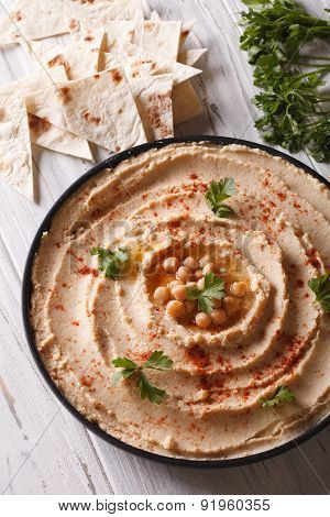 Hummus With Paprika And Parsley On The Plate Closeup. Vertical