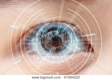 Close-up Of Woman's Brown Eye. High Technologies In The Future