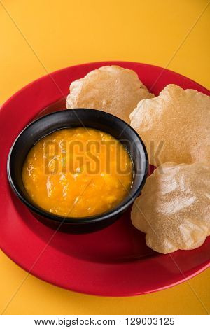 Aamras or Aam Ras Puri: Puri which is an indian fried small bread and alphonso mango pulp is a popular lunch especially during Padwa, the Marathi new year, maharashtrian lunch/dinner menu