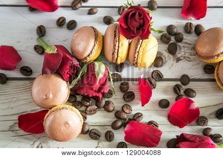 Natural french macaruns and red roses pentals on flat