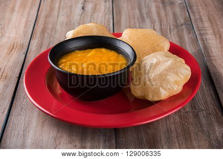 Aamras or Aam Ras Puri: Puri which is an indian fried small bread and alphonso mango pulp is a popular lunch especially during Padwa, the Marathi new year, maharashtrian lunch/dinner menu