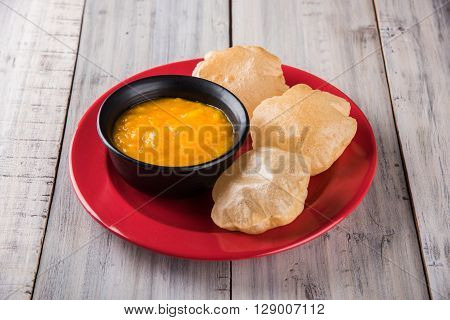 Aamras or Aam Ras Puri: Puri which is an indian fried small bread and alphonso mango pulp is a popular lunch especially during Padwa, the Marathi new year, maharashtrian lunch/dinner menu