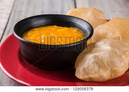 Aamras or Aam Ras Puri: Puri which is an indian fried small bread and alphonso mango pulp is a popular lunch especially during Padwa, the Marathi new year, maharashtrian lunch/dinner menu