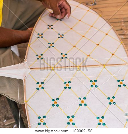 Man is making Thai kite, Chula kite