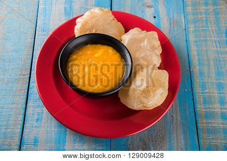 Aamras or Aam Ras Puri: Puri which is an indian fried small bread and alphonso mango pulp is a popular lunch especially during Padwa, the Marathi new year, maharashtrian lunch/dinner menu