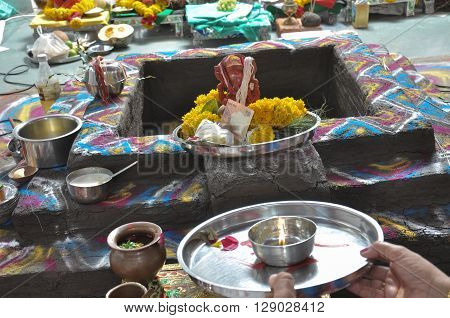 Men Doing Pray Of Lord Ganesha For Wedding