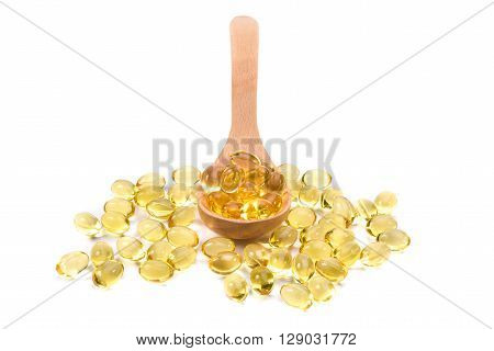 Fish Oil Capsules In A Wood Spoon On White Background