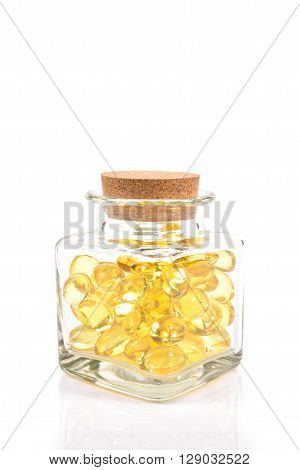 Fish Oil Capsules In Translucent Bottle On White Background