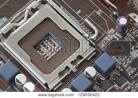 Focus CPU socket on motherboard of computer for the design background technology.