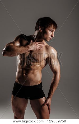 Strong Athletic Man Showing Muscular Body And Sixpack Abs. Showing His Body. Fitness Model. Great Fo