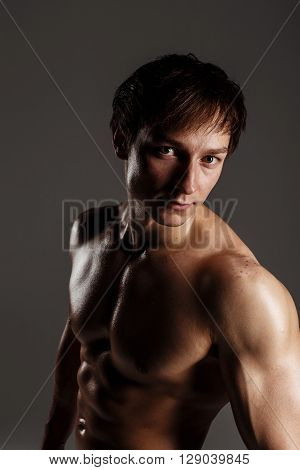 Strong Athletic Man Showing Muscular Body And Sixpack Abs. Showing His Body. Fitness Model. Great Fo