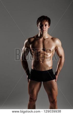 Strong Athletic Man Showing Muscular Body And Sixpack Abs. Showing His Body. Fitness Model. Great Fo
