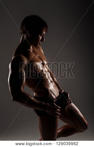 Muscular Male Model Bodybuilder Before Training. Studio Shot On Gray Background. Fitness Model. Grea