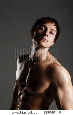 Strong Athletic Man Showing Muscular Body And Sixpack Abs. Showing His Body. Fitness Model. Great Fo