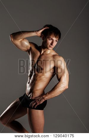 Muscular Male Model Bodybuilder Before Training. Studio Shot On Gray Background. Fitness Model. Grea