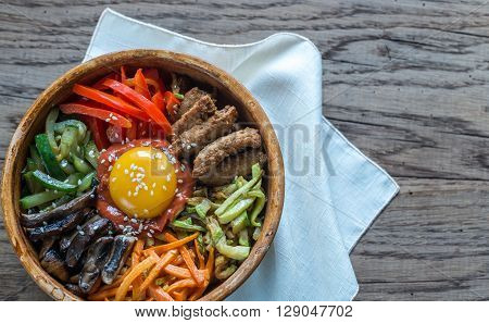 Bowl Of Bibimbap On The Wooden Table