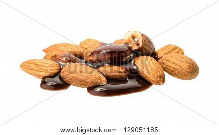 Pouring Melted Chocolate And Almond Nuts Isolated. Without Shadow