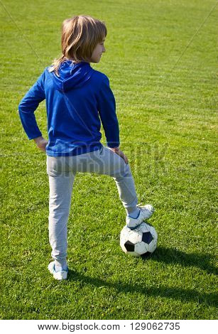 Boy playing football boy, sport, action, outdoors, sunlight,