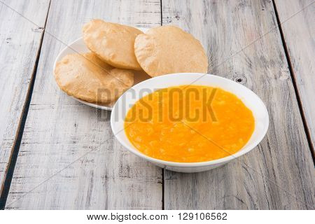 Aamras or Aam Ras Puri: Puri which is an indian fried small bread and alphonso mango pulp is a popular lunch especially during Padwa, the Marathi new year, maharashtrian lunch/dinner menu