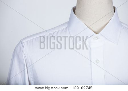 Tailored white shirt on a mannequin in studio