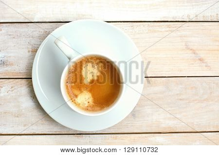 Espresso In The Cup On The Wooden Background