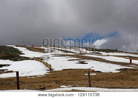 SERRA DA ESTRELA, PORTUGAL - APRIL 24, 2016: People on the mountain ski resort in Serra da Estrela. Serra da Estrela is the only ski resort in Portugal, in April 2016. Serra da Estrela, Portugal