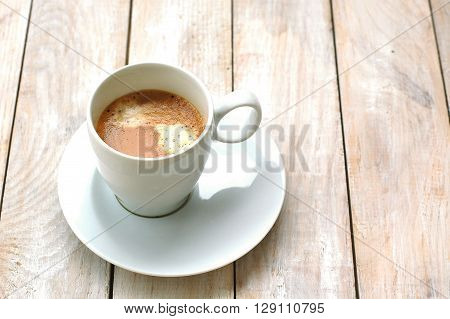 Espresso In The Cup On The Wooden Background