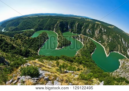 Meanders at rocky river Uvac gorge on sunny morning, southwest Serbia
